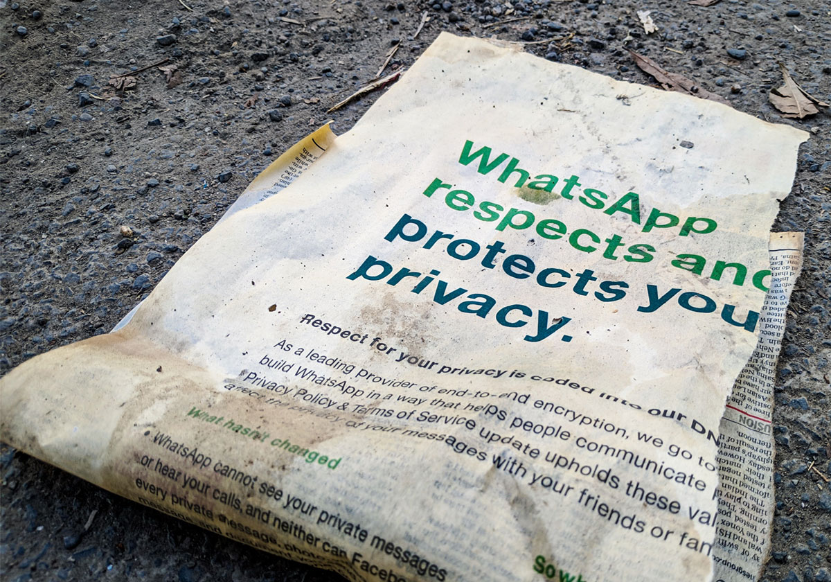 Ripped newspaper with Whasapp Security headline