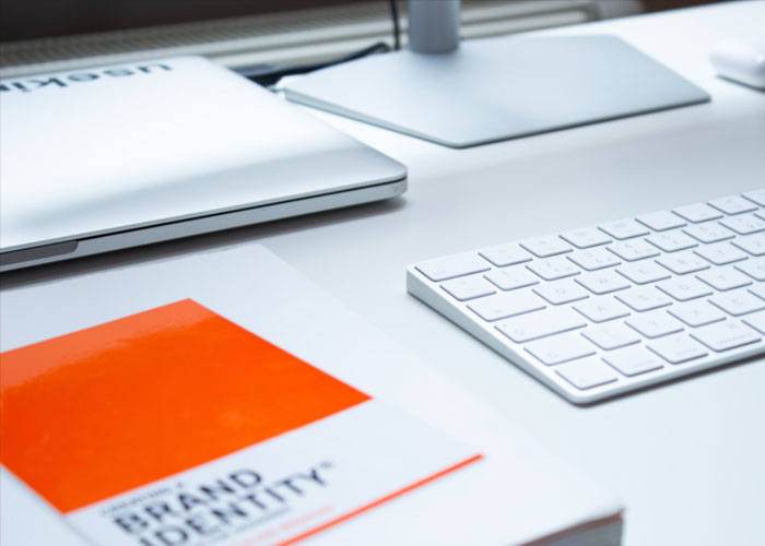 A brand identity document on a desk