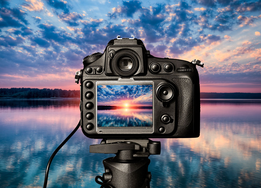 A camera viewfinder showing sunset over water