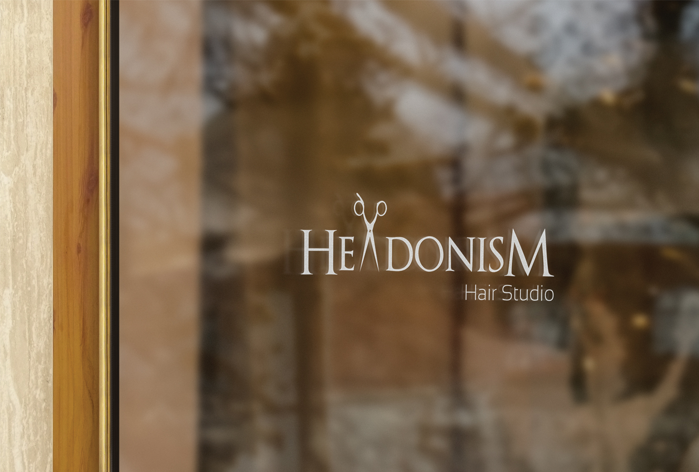 Salon window displaying Headonism logo