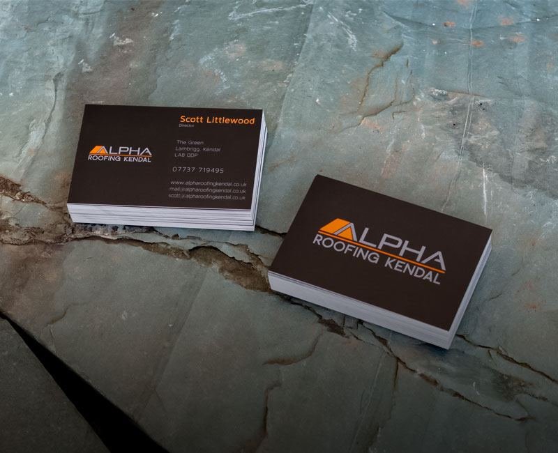 Alpha Roofing Kendal business cards on slate